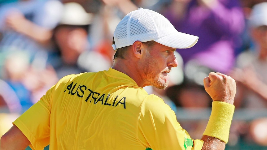 On top ... Lleyton Hewitt celebrates during the reverse singles match against Aleksandr Nedovyesov