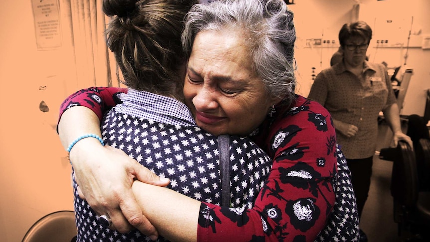 ABC presenter Jill Emberson hugging her daughter Malia, for a story about difficult medical conversations