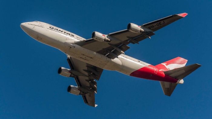 A Qantas 747 flying through the sky