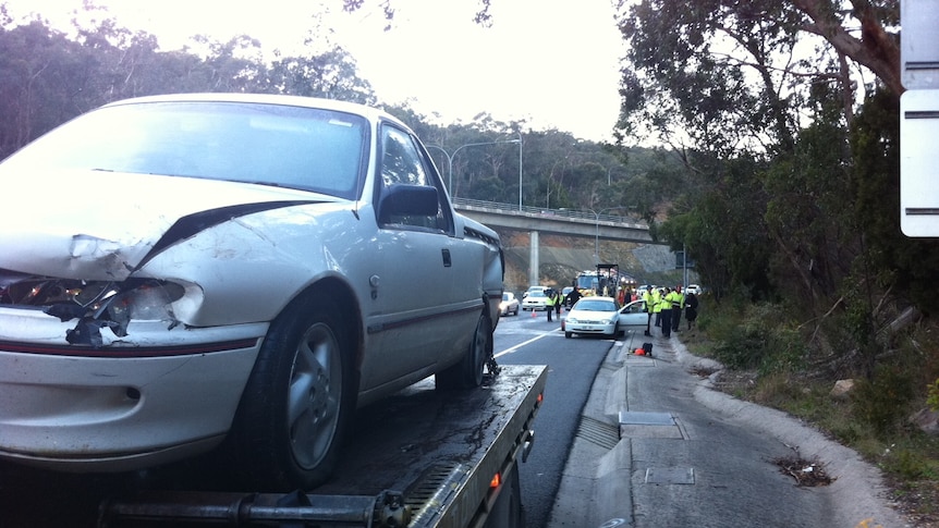 A fallen excavator bucket caused the multi-car crash