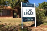 A for-lease sign outside a brick house in Karratha