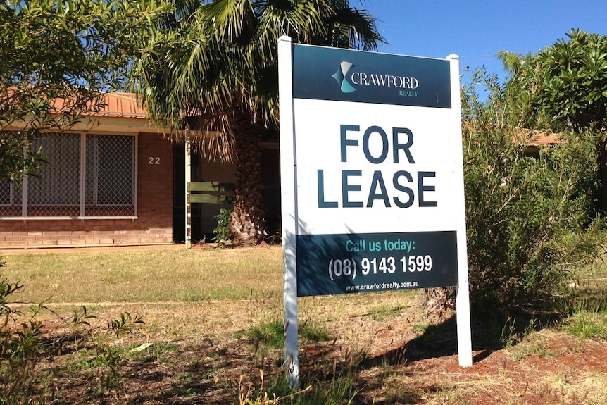 A for-lease sign outside a brick house in Karratha