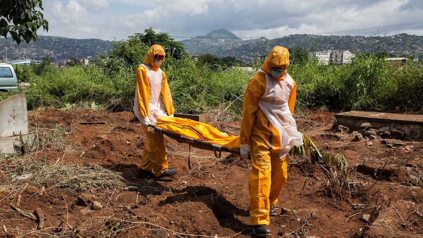 A team of funeral agents bury victims of the Ebola virus in Sierra Leone