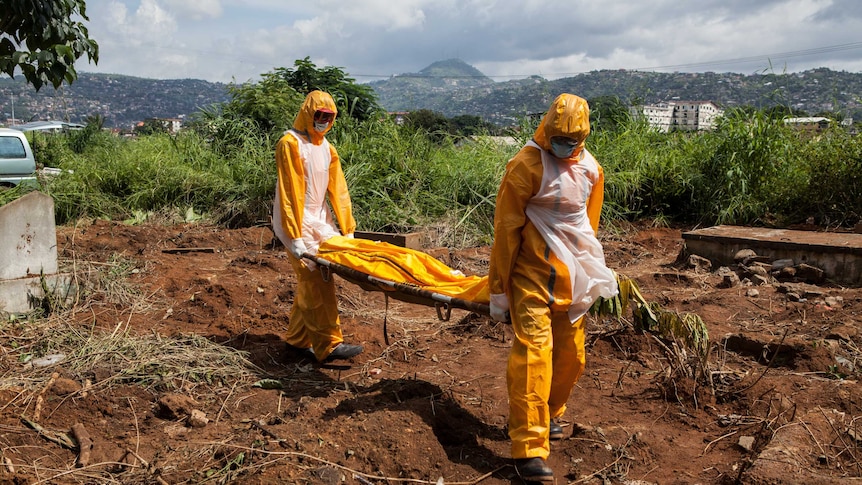 A team of funeral agents bury victims of the Ebola virus in Sierra Leone