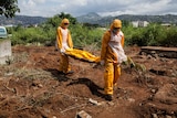 A team of funeral agents bury victims of the Ebola virus in Sierra Leone