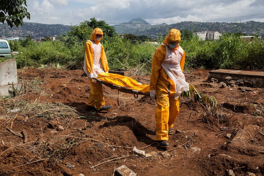A team of funeral agents bury victims of the Ebola virus in Sierra Leone