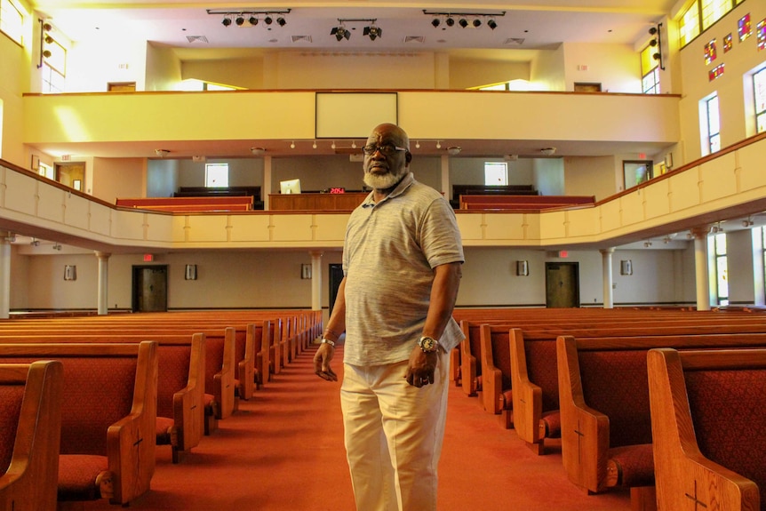 A man stands in empty church