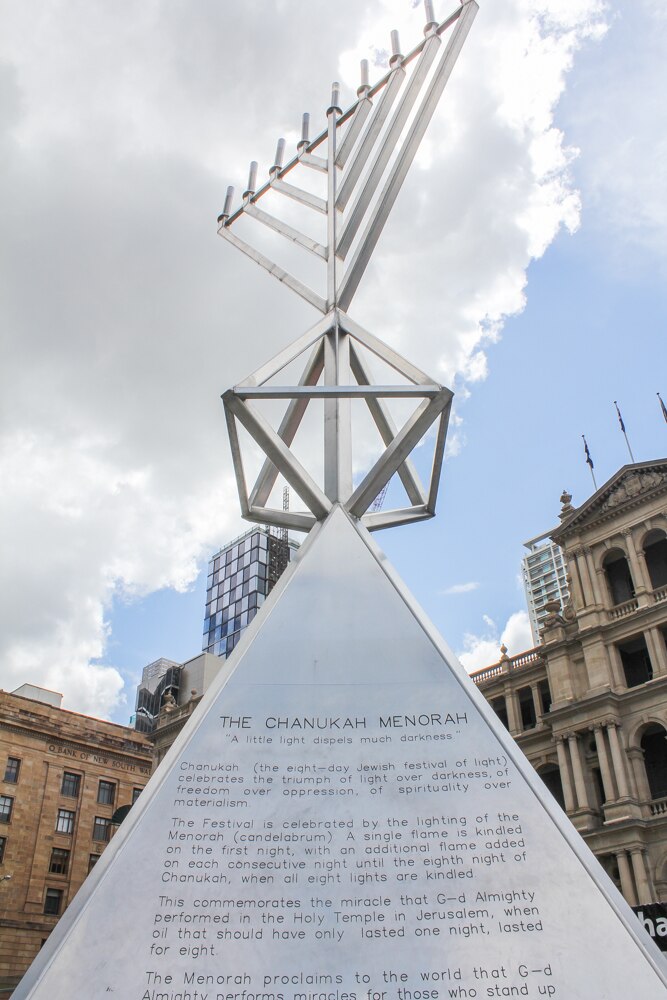 Hanukkah marked in Brisbane as giant menorah burns bright in CBD during