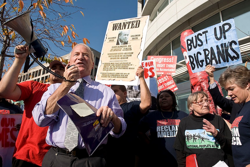 Andy Stern holds a megaphone outside Goldman Sachs offices in 2009.