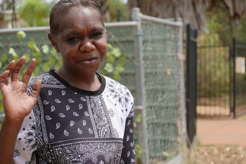 Anne Marie Miller from the APY Lands waves hello to the camera.