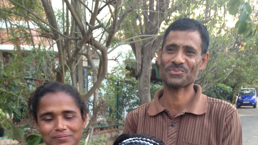 Abdul, user of Pollinate Energy solar lights, with his family