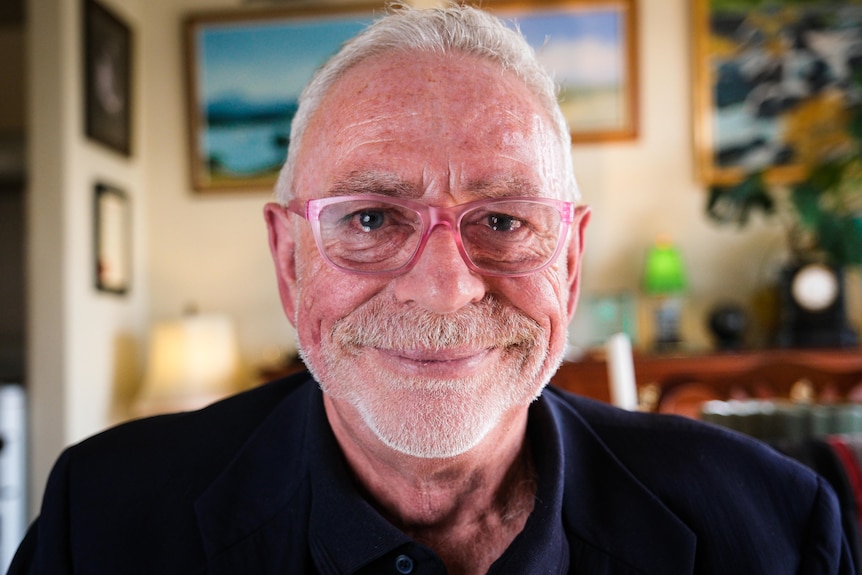 A close-up photograph of David Polson smiling