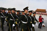 Paramilitary police walk through Tiananmen Square in Beijing