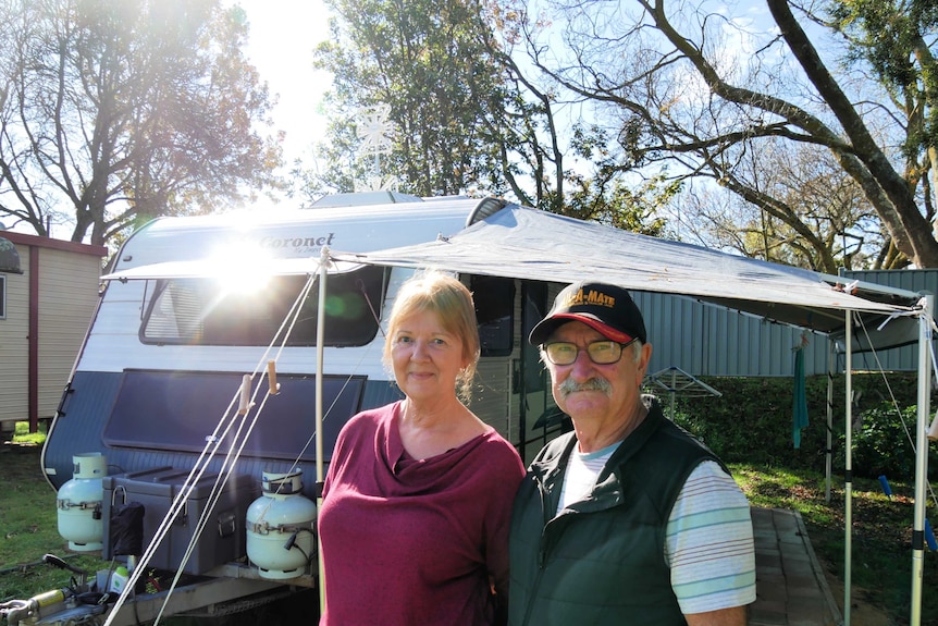 Gary and Jane out the front of their caravan