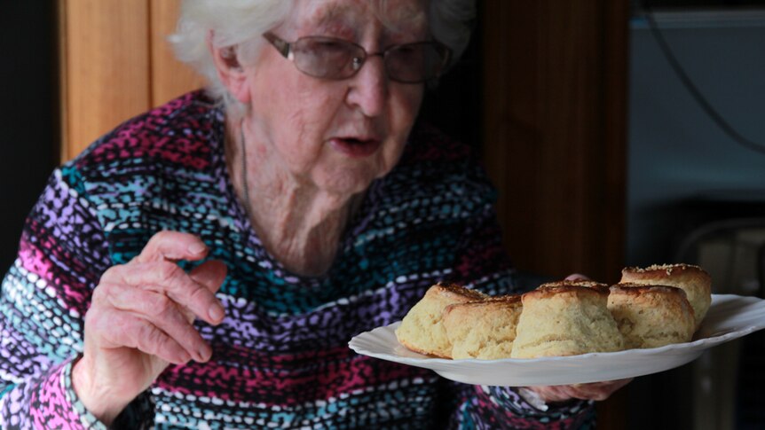Betty Watt holding a plate of homemade scones