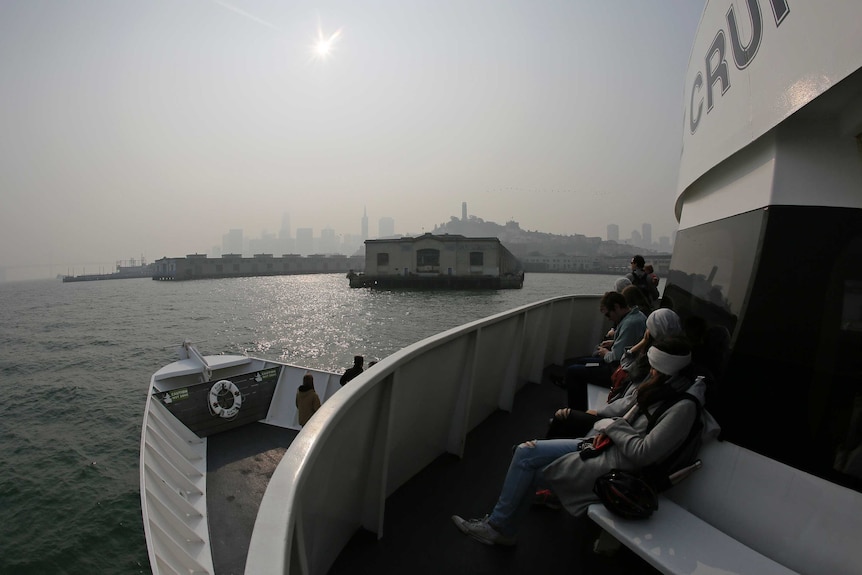 San Francisco skyline obscured by smoke and haze from wildfires.