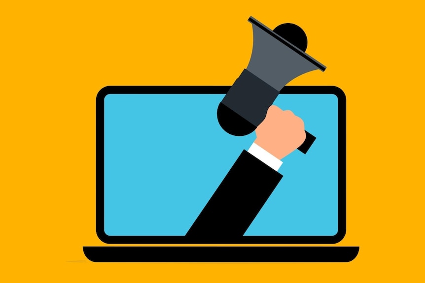 An illustration shows a hand emerging from a laptop holding a loudspeaker.