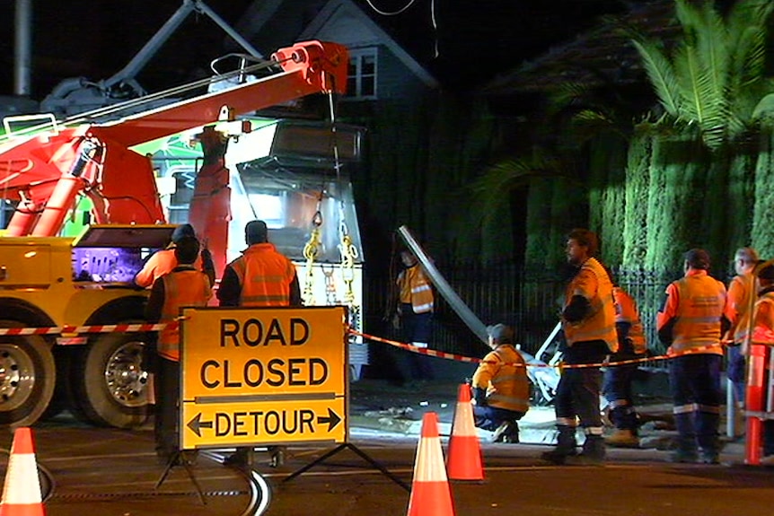 Crews working to tow a tram that derailed in Ascot Vale.