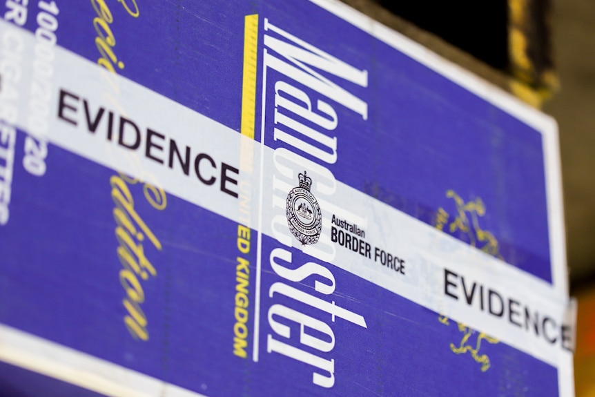 A large cardboard box with Australian Border Force evidence tape across it. 