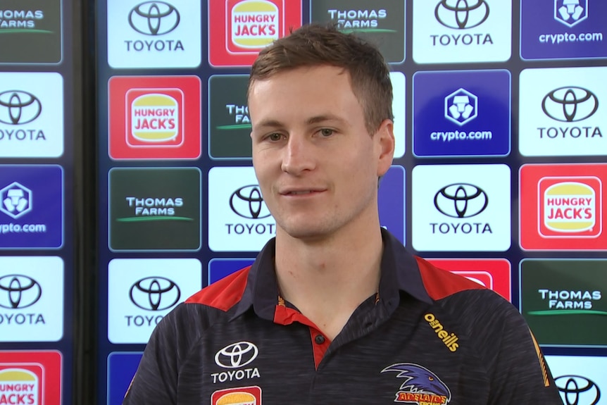 A footballer at a media conference.