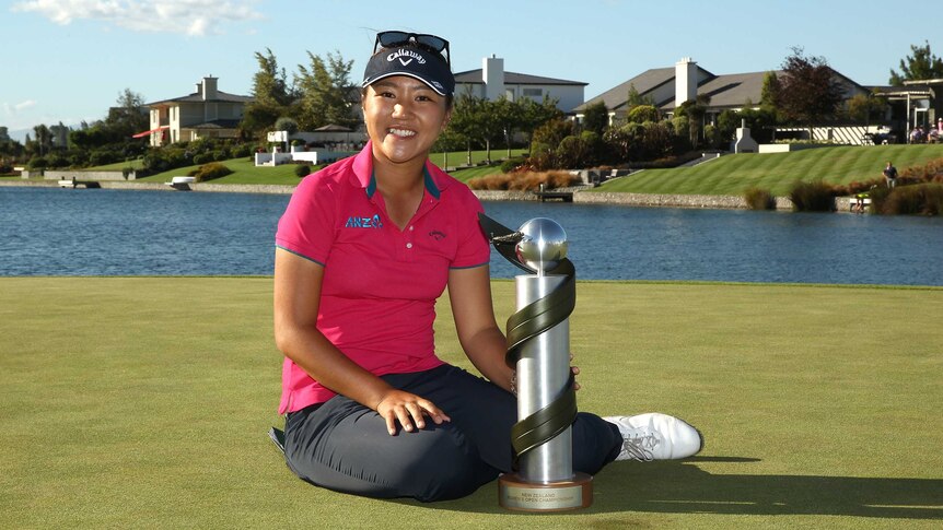 Lydia Ko celebrates with New Zealand Open trophy