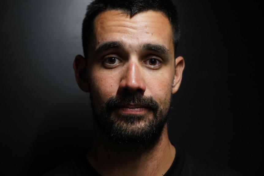 Man with black hair close up shot 