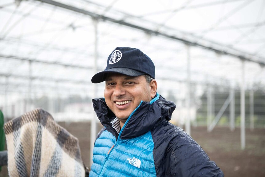 Emergency expert Rajendra Aryal at FAO's greenhouse construction site.