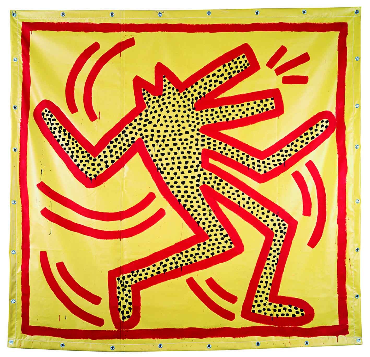 Colour photograph of iconic Keith Haring character outlined in red with black dot filling outline on canvas.