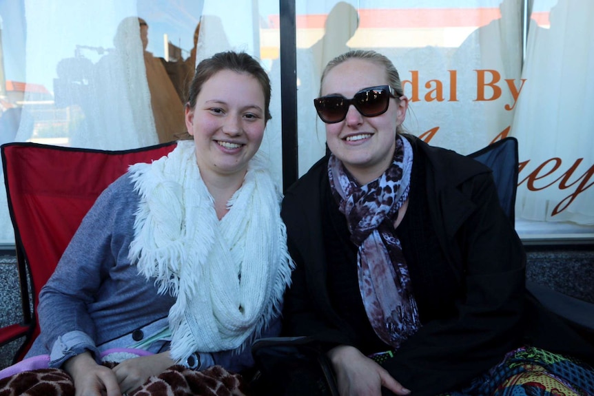 Amanda Burgess and Jenna Inglis have been camped outside the shop on Oxford Street since 2am.