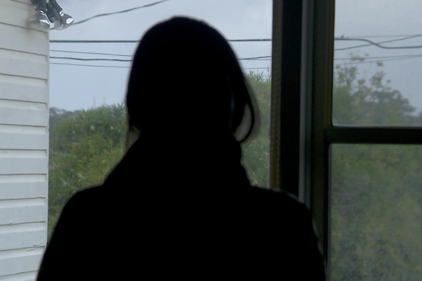the silhoutte of a woman at a domestic violence shelter in western sydney 