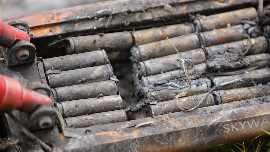 A close up view of a burnt out e-scooter battery