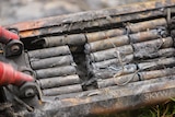A close up view of a burnt out e-scooter battery