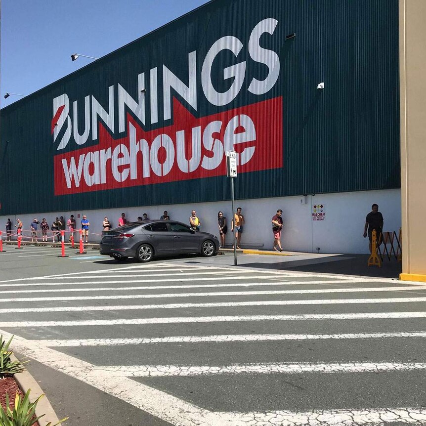 Customers line up due to social distancing restrictions outside Bunnings at Oxley in Brisbane's south-west.