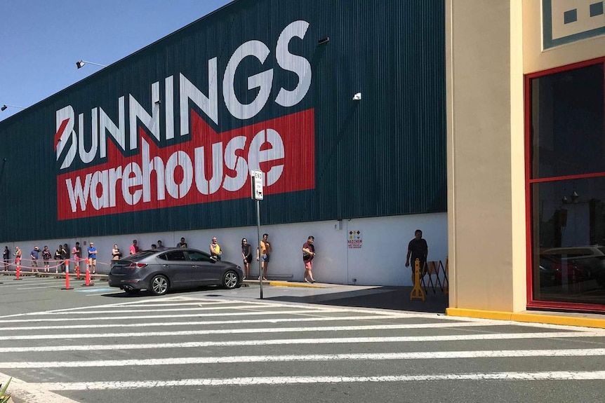 Customers line up due to social distancing restrictions outside Bunnings at Oxley in Brisbane's south-west.