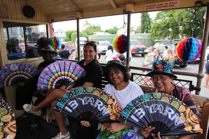 Kimberley women sit in pride tram in Broome pride celebrations. 