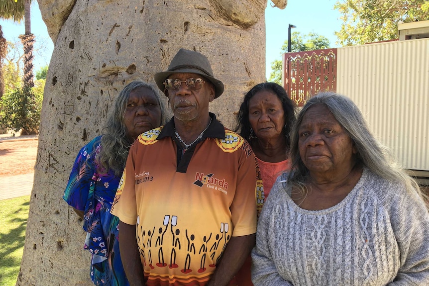 Esther, Sandy, Gabrielle and Patricia Albert stand together in front of a large tree.