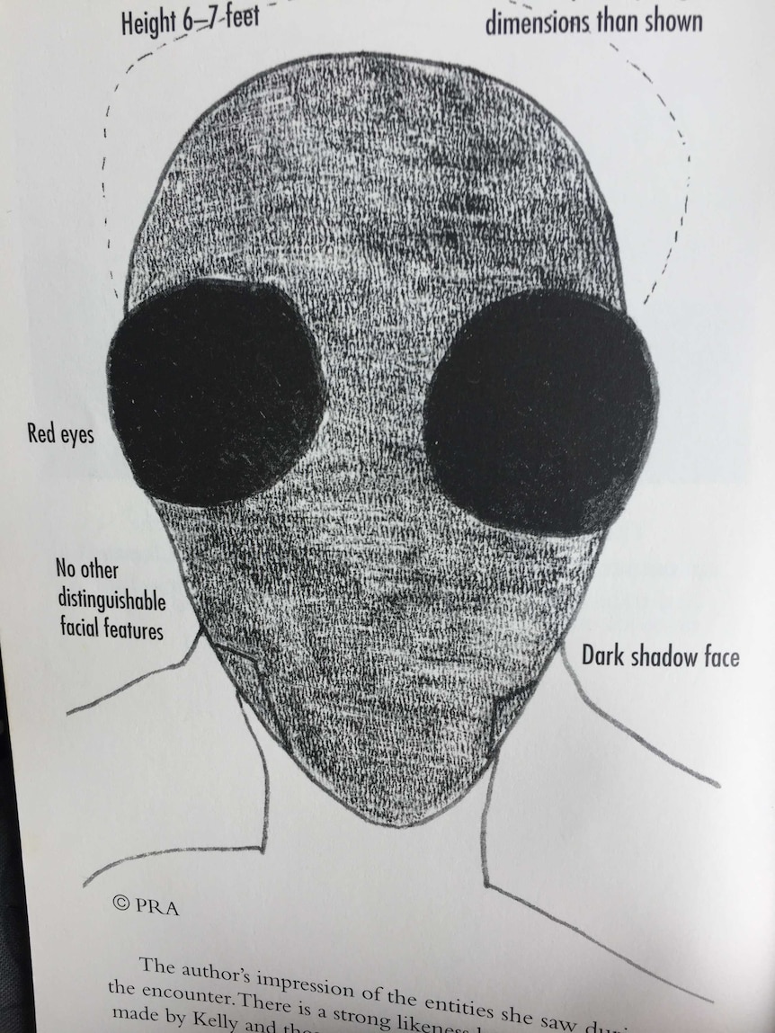 A sketch of an alien, with large dark eyes.