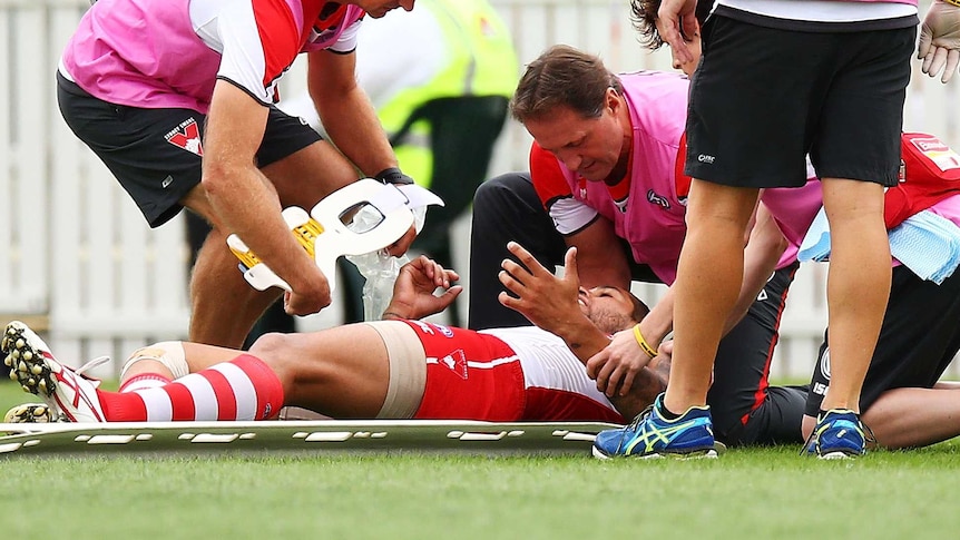 Lance Franklin stretchered off after head knock