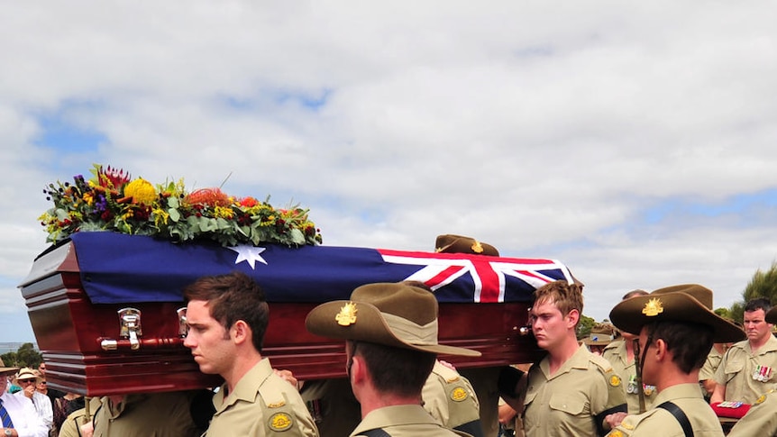 Final trip: members of the combat engineer regiment form an honour guard to carry Sapper Larcombe's coffin.