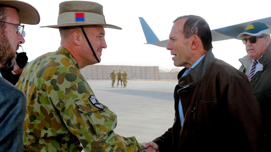 Commander Combined Team Uruzgan Colonel Wade Stothart welcomes Prime Minister Tony Abbott.