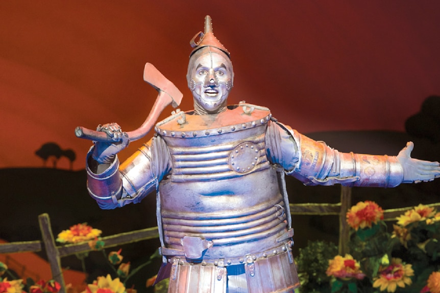 A man dressed as the tin man from the Wizard of Oz