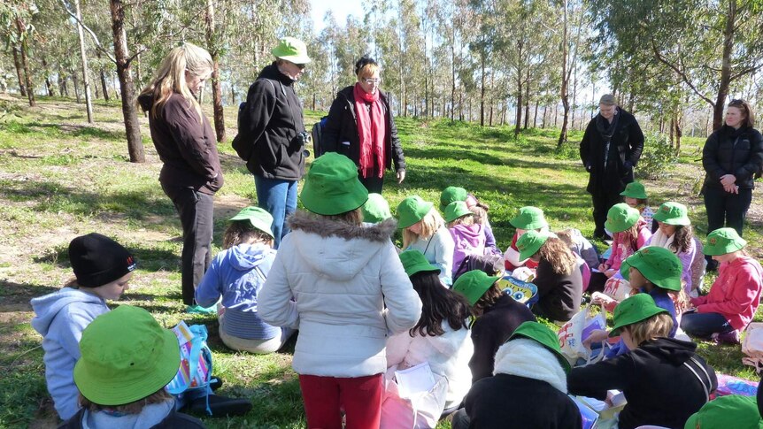 Woden Valley Youth Choir members taking notes on their sound walk at the National Arboretum.