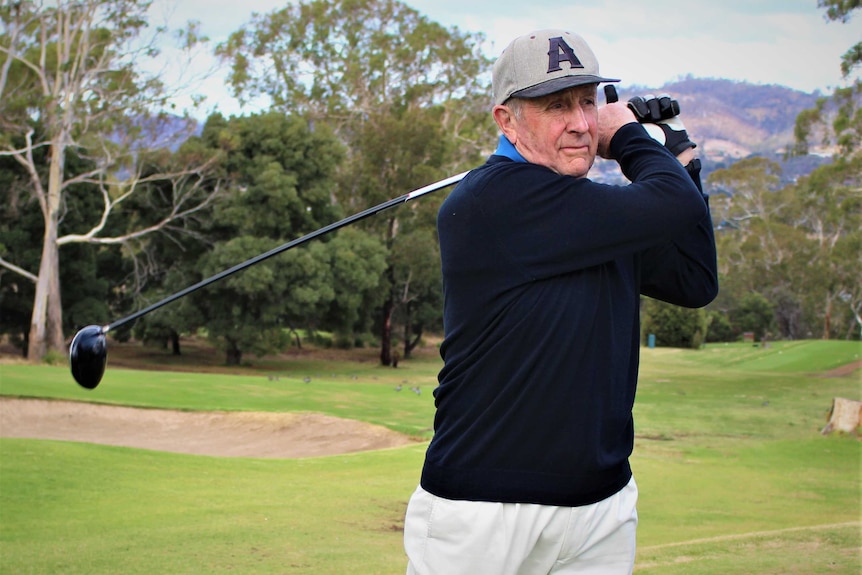 Hobart golfer Albie Francis swings a wood in a posed photo.