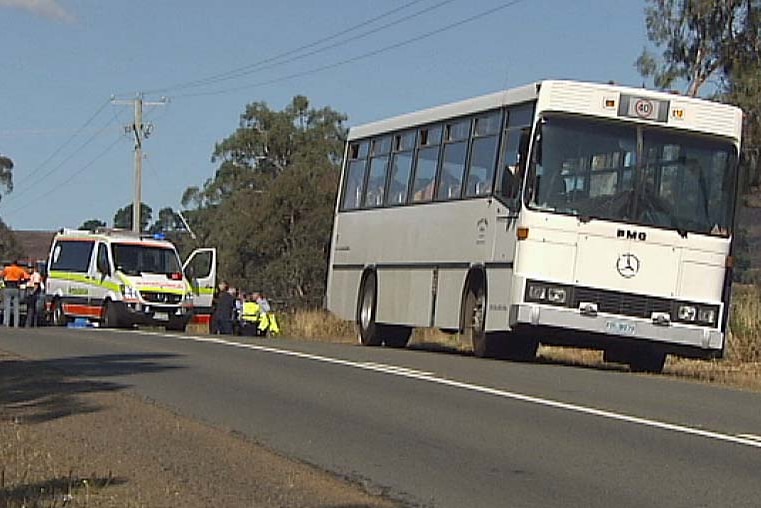 School bus parks on side of Gordon River Road, Karanja, after student is hit by passing ute.
