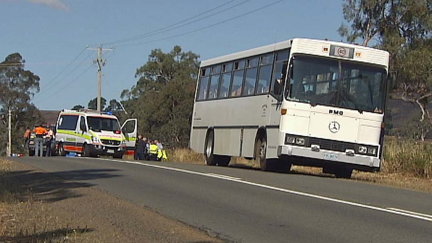 School bus parks on side of Gordon River Road, Karanja, after student is hit by passing ute.