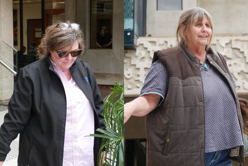 Two mature women in jeans and jackets photographed near a staircase outside of a courthouse.