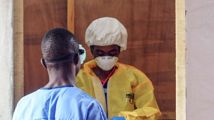 Health workers - like this one from the Liberian capital Monrovia - form the front line in treating those infected with Ebola.