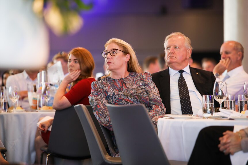 Rita Saffioti and Nigel Satterley seated next to each other at a business lunch