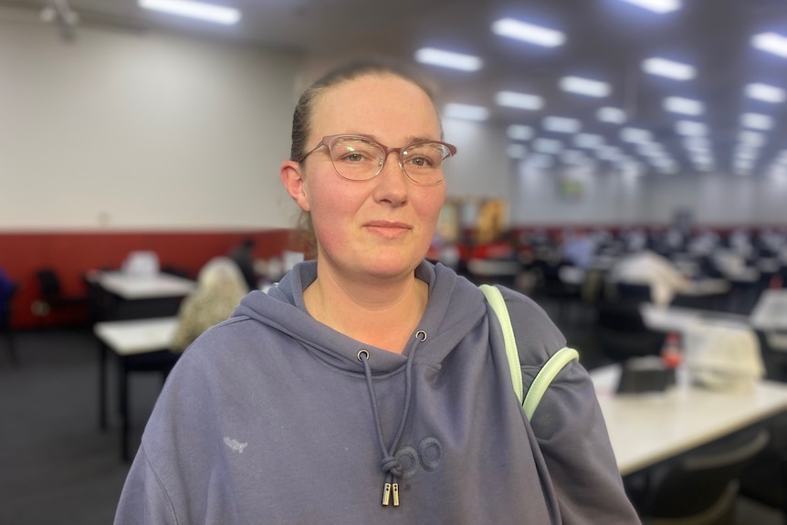 Sharon in a sweatshirt at a bingo hall