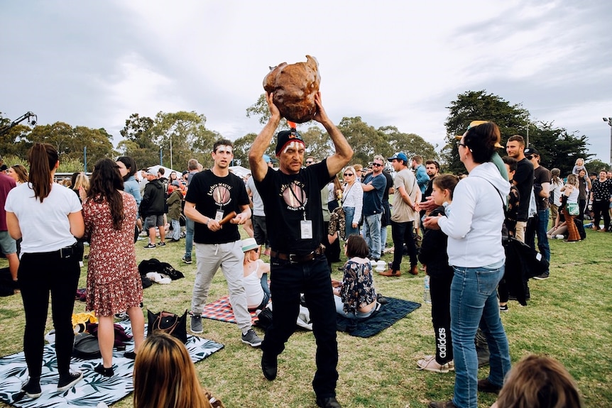 A Boandik elder carries the smoking ceremony through the One Night Stand crowd during Welcome to Country.